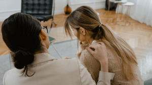 Mental health worker or friend talking to a distressed person