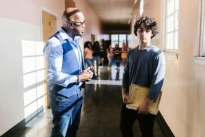 A teacher supporting a student with mental health concerns in the classroom