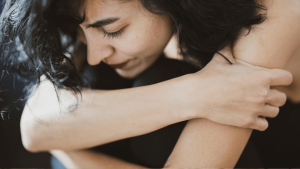 Teenager experiencing emotional distress alone indoors — possible early signs of BPD